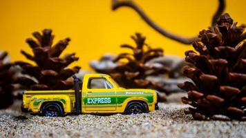 Minahasa, Indonesia  December 2022, the toy car among the pine cones photo