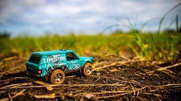 South Minahasa, Indonesia  February 2023, toy car on green grass photo