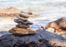 Picture of a rock on the coast of the sea They are stacked beautifully in sequence, still see island And sky clear, look relaxed. Suitable relax and travel Khao Leam Ya National Park Rayong Thailand photo