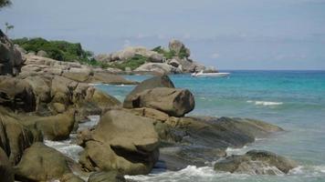 Turquoise waves rolled on the beach of Koh Miang island, Similan Islands, slow motion video