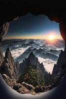 view of a mountain range from a cave. . photo