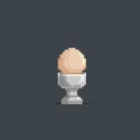egg in the cup with pixel art style vector