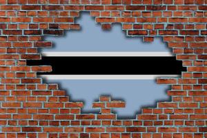 3D Flag of Botswana behind the broken old stone wall background. photo