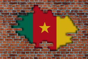 3D Flag of Cameroon behind the broken old stone wall background. photo