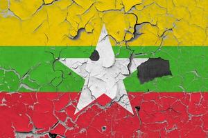 3D Flag of Myanmar on an old stone wall background. photo