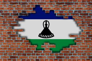 3D Flag of Lesotho behind the broken old stone wall background. photo