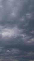 Cloudy sky before storm vertical video time lapse on a cloudy day.