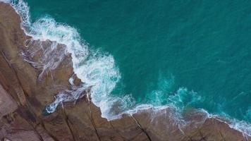 Top view of the desert beach on the Atlantic Ocean. Coast of the island of Tenerife. Aerial drone footage of sea waves reaching shore video