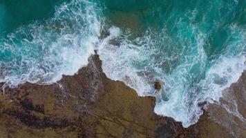 Top view of the desert beach on the Atlantic Ocean. Coast of the island of Tenerife. Aerial drone footage of sea waves reaching shore video