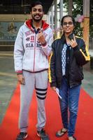 New Delhi, India - April 04 2023 - Unidentified people showing their ink-marked fingers after casting votes in front of polling booth of east Delhi area for MCD local body Elections 2022 photo