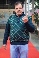 New Delhi, India - April 04 2023 - Unidentified people showing their ink-marked fingers after casting votes in front of polling booth of east Delhi area for MCD local body Elections 2022 photo