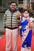 New Delhi, India - April 04 2023 - Unidentified people showing their ink-marked fingers after casting votes in front of polling booth of east Delhi area for MCD local body Elections 2022 photo