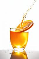 Splash with splashes in a glass with juice from a piece of orange. Vitamins, healthy food. . photo