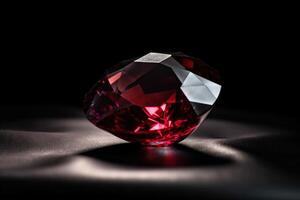 Red diamond is a rare precious natural geological stone on a black background in low key. . photo