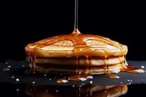 Pancake, a pancake with honey. Black background. photo