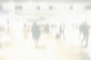 Abstract White Blurred of Crowded People Walking in Subway Station Background. photo