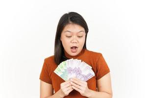 Holding Ten Thousand and Twenty Thousand Indonesian Rupiah Banknote Of Beautiful Asian Woman Isolated On White Background photo