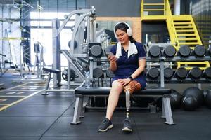 Young female with one prosthetic leg with the practice of using prosthetic legs to walk, exercise and and daily activities photo