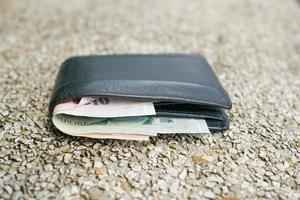 left wallet on a bench in the park photo