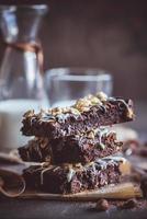 Sweet homemade brownies with chocolate and almonds photo