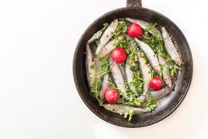 Smelts fish in the pan photo