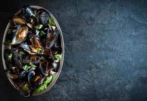 Cooked mussels in the plate photo
