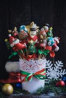 Cake pops with Christmas decoration in the basket photo
