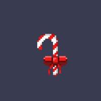 candy cane with red ribbon in pixel art style vector