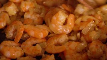 Cooking shrimp in garlic-cream sauce closeup video