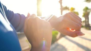 Smartwatch. Woman using smart watch. Closeup of female touching touch screen on watch entering watch app video