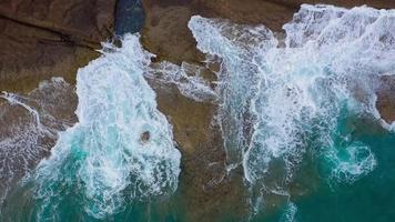 Top view of the desert beach on the Atlantic Ocean. Coast of the island of Tenerife. Aerial drone footage of sea waves reaching shore video