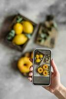 Delicious fresh donuts in yellow glaze with lemon flavor filling photo