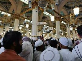 Medina, Saudi Arabia, April 2023 - Muslim pilgrims are going to visit Roza Rasool at Masjid Al Nabawi Madinah. photo