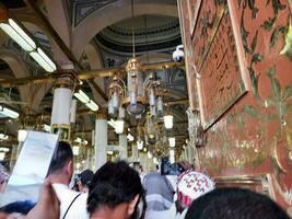 Medina, Saudi Arabia, April 2023 - Muslim pilgrims are going to visit Roza Rasool at Masjid Al Nabawi Madinah. photo