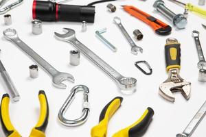 Set of tools for repair in a case on a white background. Assorted work or construction tools. Wrenches, Pliers, screwdriver. Top view photo