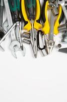 Set of tools for repair in a case on a white background. Assorted work or construction tools. Wrenches, Pliers, screwdriver. Top view photo