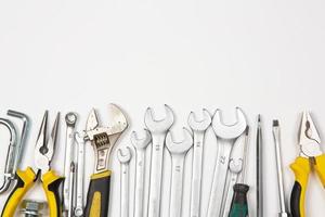 Set of tools for repair in a case on a white background. Assorted work or construction tools. Wrenches, Pliers, screwdriver. Top view photo