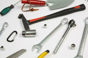 Set of tools for repair in a case on a white background. Assorted work or construction tools. Wrenches, Pliers, screwdriver. Top view photo