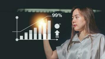 Businesswoman drawing a graph on a virtual screen. Business concept. photo