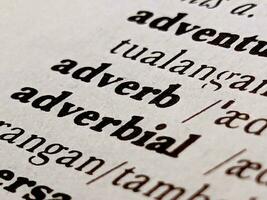 a close up of the word adverb in the English to Indonesian dictionary. For word background or wallpaper photo