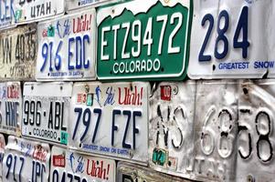 Wall Covered with Utah and Colorado License Plates photo