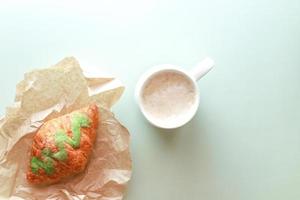 Flat lay pistachio croissant with coffee photo