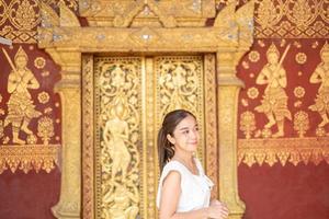 Young Asian Woman at Wat Sene Souk Haram ,Luang Prabang, LAOS photo