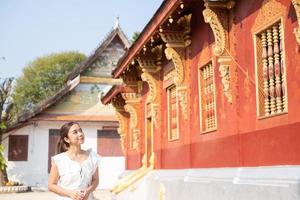 Young Asian Woman at Wat Sene Souk Haram ,Luang Prabang, LAOS photo