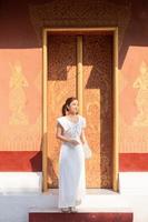 Young Asian Woman at Wat Sene Souk Haram ,Luang Prabang, LAOS photo