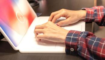 Female using the laptop and preparing to work at their home. photo