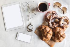Coffee and croissant served photo