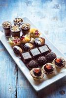 Sweet homemade mini cakes on the table photo