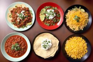 Mexican cuisine. Traditional mexican tacos with beef, tomato, onion and salsa. Mexican nachos photo