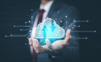 Businessman holding connect to data information on the Cloud Computing Technology Internet Storage Network Concept And a large database big data Through internet technology, Cloud sharing download photo